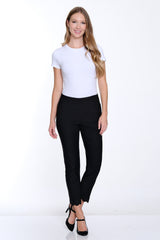 Woman wearing a white t-shirt and black pants on a white background