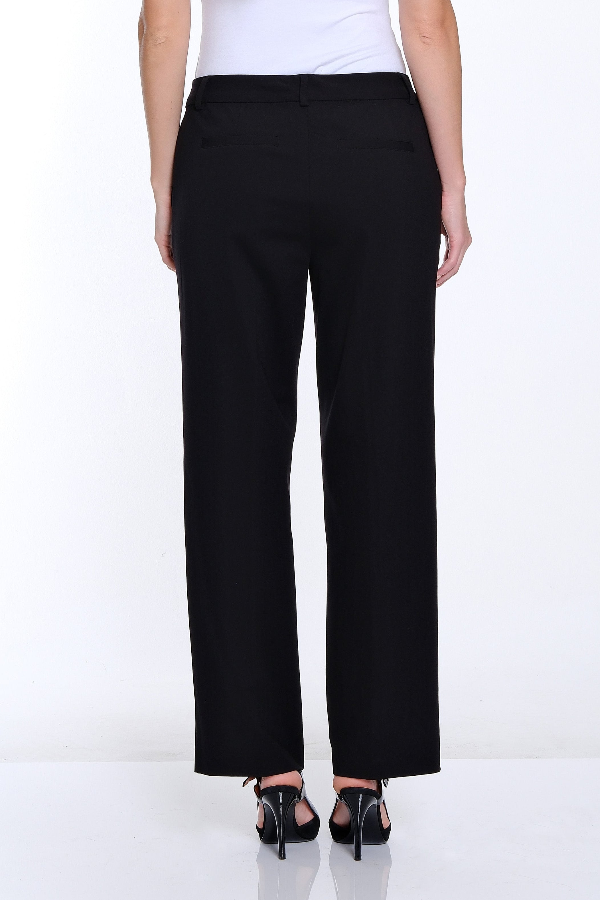 Person wearing a white shirt and black pants on a white background