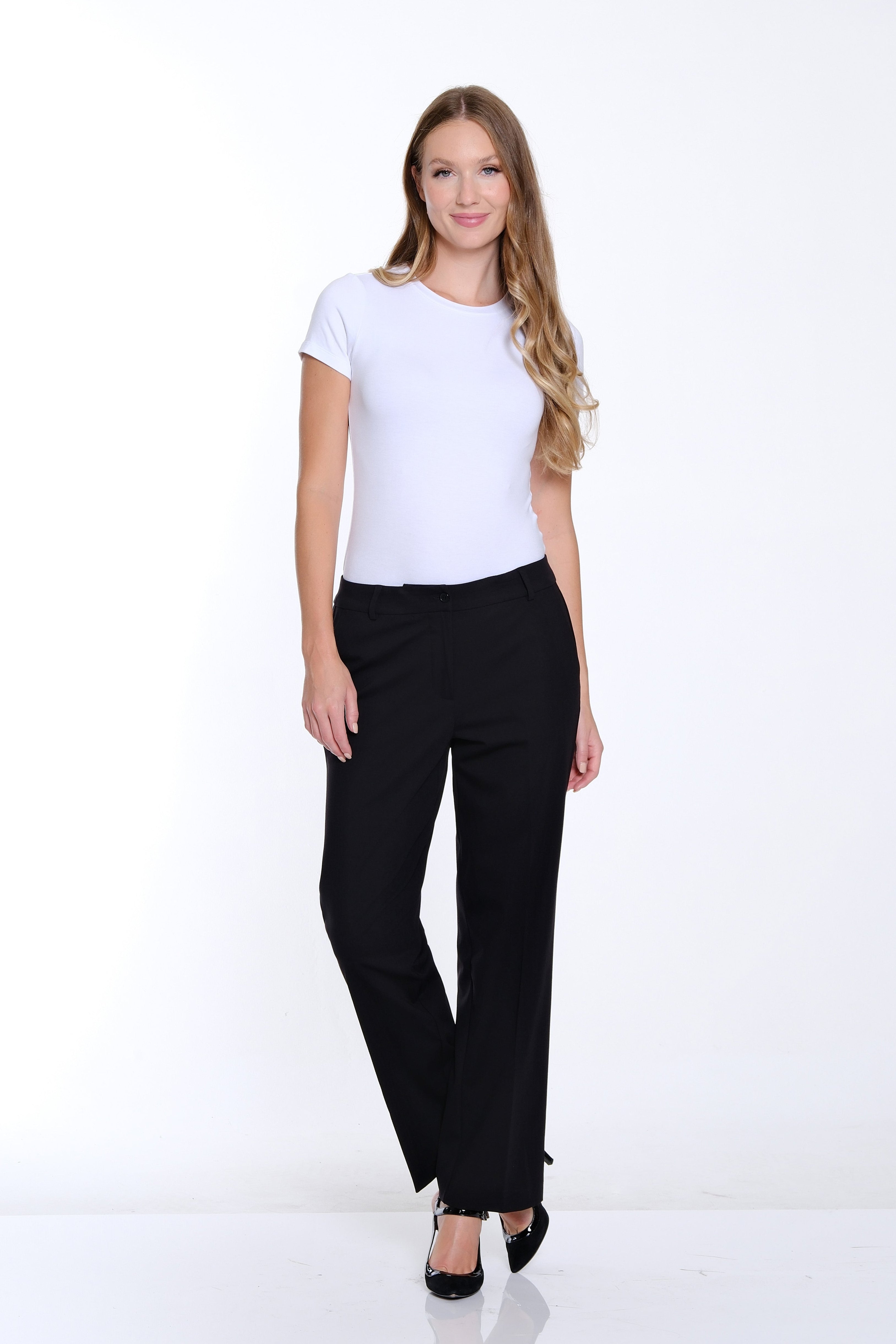Woman wearing a white t-shirt and black pants on a white background