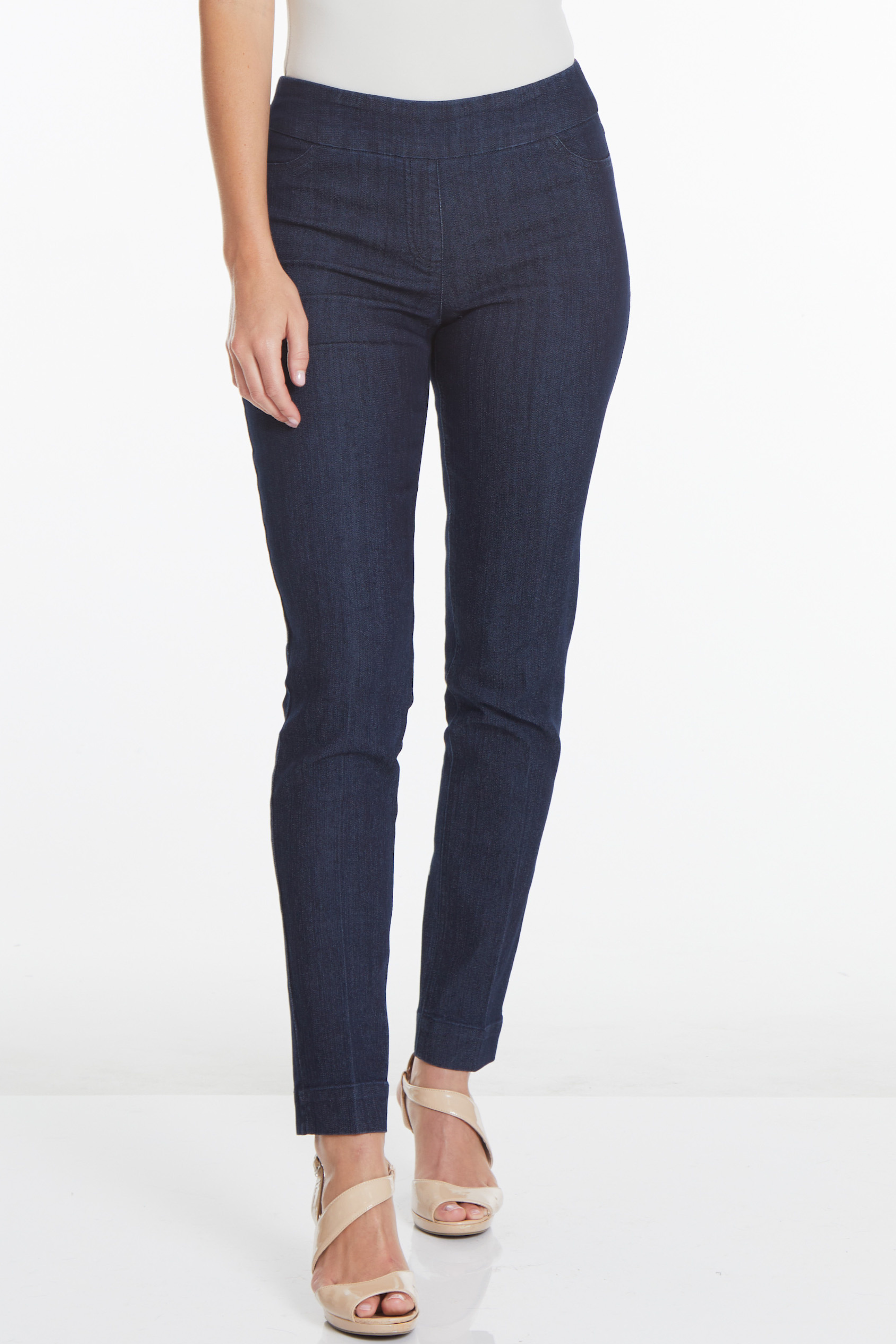 bottom half of model wearing dark wash pull-on slim leg jeans with high heel sandals